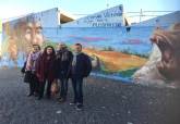 Visita a los murales artsticos de El Llano del Beal, Estrecho de San Gins y El Beal, para promocionar la Cueva Victoria