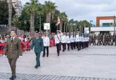 Arriado de bandera por la Fiesta Nacional